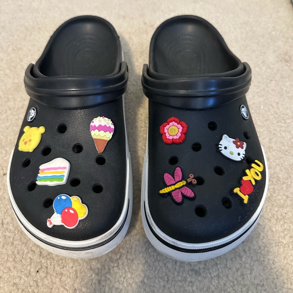 Black Crocs with assorted charms